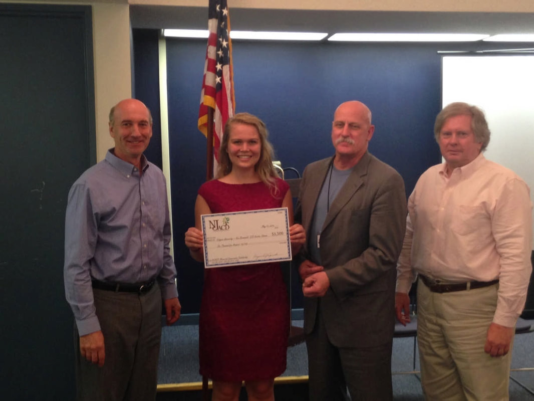 NJACD officers award a $1,500 Memorial Conservation Scholarship to Kristen Johnson